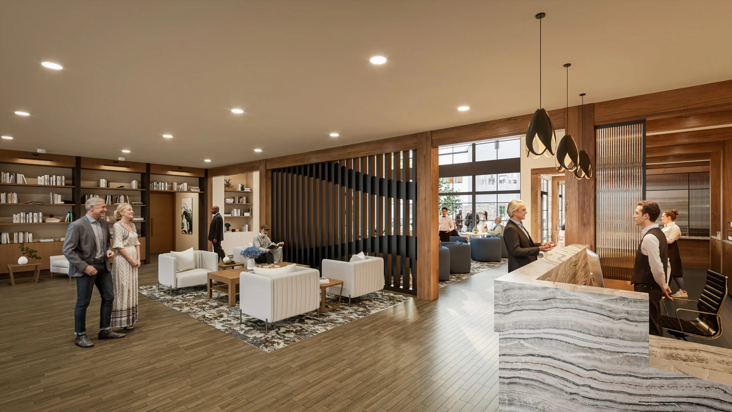 Senior living community lobby with residents and staff interacting near seating and reception desk in a well-lit, modern space.